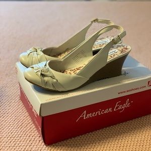 Rounded toe cream wedges